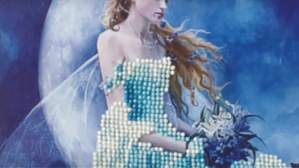 chica con vestido azul sentada en la luna hecha en diamond painting